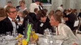 a group of people sitting at a table with a sign that says ' psychologists '