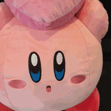 a close up of a person 's arm with a pink sweater on