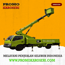 a green truck with a crane attached to the back is advertised on www.promokaroseri.com