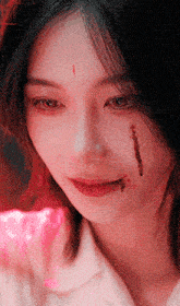 a woman with blood coming out of her mouth