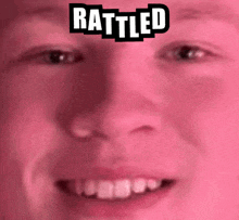 a close up of a man 's face with the words rattled above it