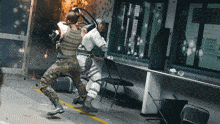 a man in a military uniform is fighting another man in a white suit