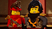 two lego characters are standing next to each other and one has a scarf around his neck
