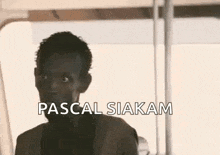 a close up of a man 's face with the words `` pascal siakam '' written above him .