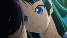 a close up of a girl 's face with green hair and blue eyes