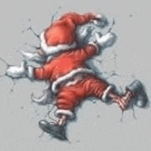 a drawing of santa claus laying on the ground on a wall .