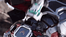 a close up of a robot with a screen that says ' x ' on it