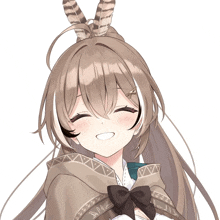 a girl with feathers in her hair is smiling and wearing a cape