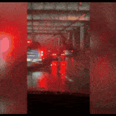 a blue truck with a license plate that says ' gmc ' on it is driving through a tunnel