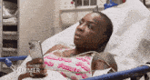 a woman is laying in a hospital bed looking at her phone with the words " on the phone summer " on the bottom