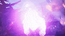 a large purple explosion is coming out of a cave .
