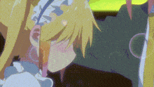a girl with blonde hair and a maid 's headband is kissing a man