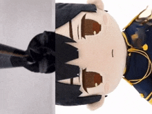a stuffed toy of a man with black hair and a blue outfit