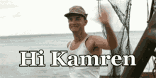 a man on a boat says hi kamren while waving