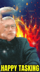 a man with glasses is surrounded by fire and the words happy tasking