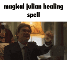 a picture of a man in a suit and tie with the words magical julian healing spell
