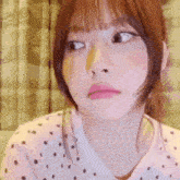 a close up of a woman making a funny face with her eyes closed .