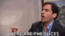 a man in a suit and blue shirt is making a funny face and says where are the slices
