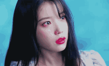 a close up of a woman with red lipstick on her lips