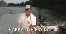 a man is sitting in a boat on a river and says `` happy fish fry day !!! ''