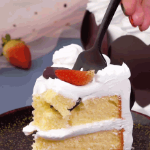 a slice of cake with a strawberry on top