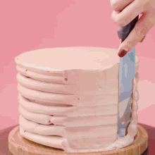 chocolate is being poured on a cake with easy plus written on the bottom right