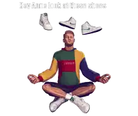 a man in a jordan sweatshirt sits in a lotus position surrounded by shoes