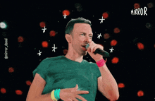 a drawing of a man singing into a microphone with the word mirror on his shirt