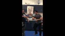 a man throws a ball in front of a sign that says lunch chicks