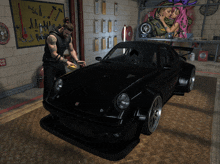 a man is standing next to a black car in a garage with a sign that says no smoking