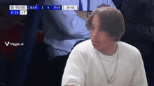 a man in a white shirt is sitting in front of a scoreboard that says bar 1 4 par ( 4-6 )