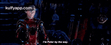 a man in a spider-man suit is talking to a man in a suit .