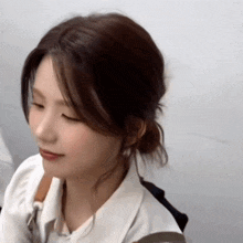 a close up of a woman with her eyes closed