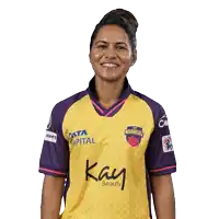 a woman in a yellow and purple warriors jersey