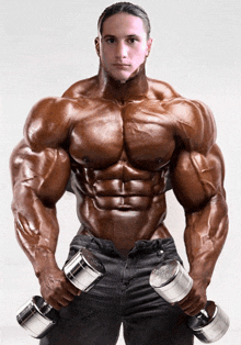 a very muscular man is holding a pair of dumbbells with the letter s on the bottom