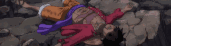 a man is laying on his back on a rocky surface .