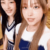 two girls are posing for a picture and one of them has the name njfaerie on her shirt