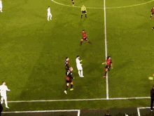 a soccer game is being played on a field that has a banner that says mci