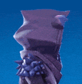 a purple statue with a glowing face and spikes on it