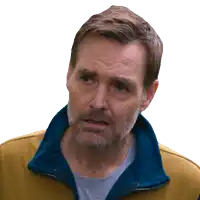 a man with a beard wearing a yellow and blue jacket