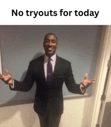 a man in a suit and tie is standing with his arms outstretched in front of a wall with the words no tryouts for today