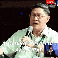 a man speaking into a microphone with the words ang hirap niyan ha ang hirap on the bottom