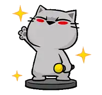 a statue of a cat with red eyes is holding a gold coin .