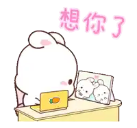 a cartoon rabbit is sitting at a desk with a laptop and a picture of two rabbits on the table .