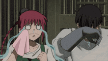 a girl with red hair is crying while a man wipes his eyes