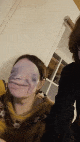 a woman with a mask on her face looks like a monster