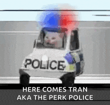 a cat is driving a police van down a street .