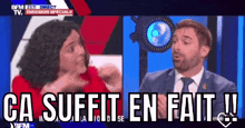 a man in a suit and tie is talking to a woman in a red shirt and the words ca suffit en fait