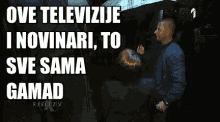 a woman holding an umbrella with the words " ove televizije i novinari to sve sama gamad " above her