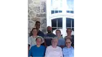 a group of people are posing for a picture with the words local uncle achieves terminal velocity written below them